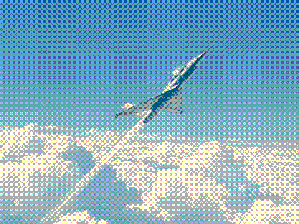 Painted experimental jet climbing steeply above a brilliant white sea of clouds into deep blue sky.